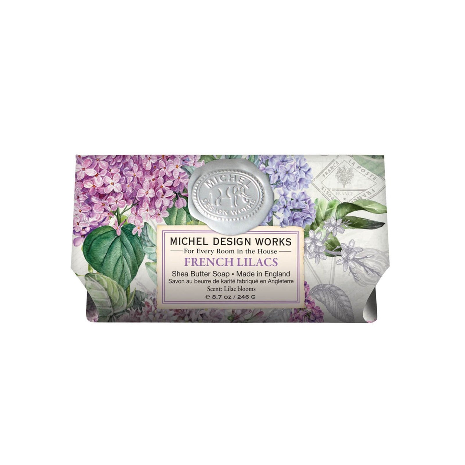 Bar of soap with floral packaging and label on a white background