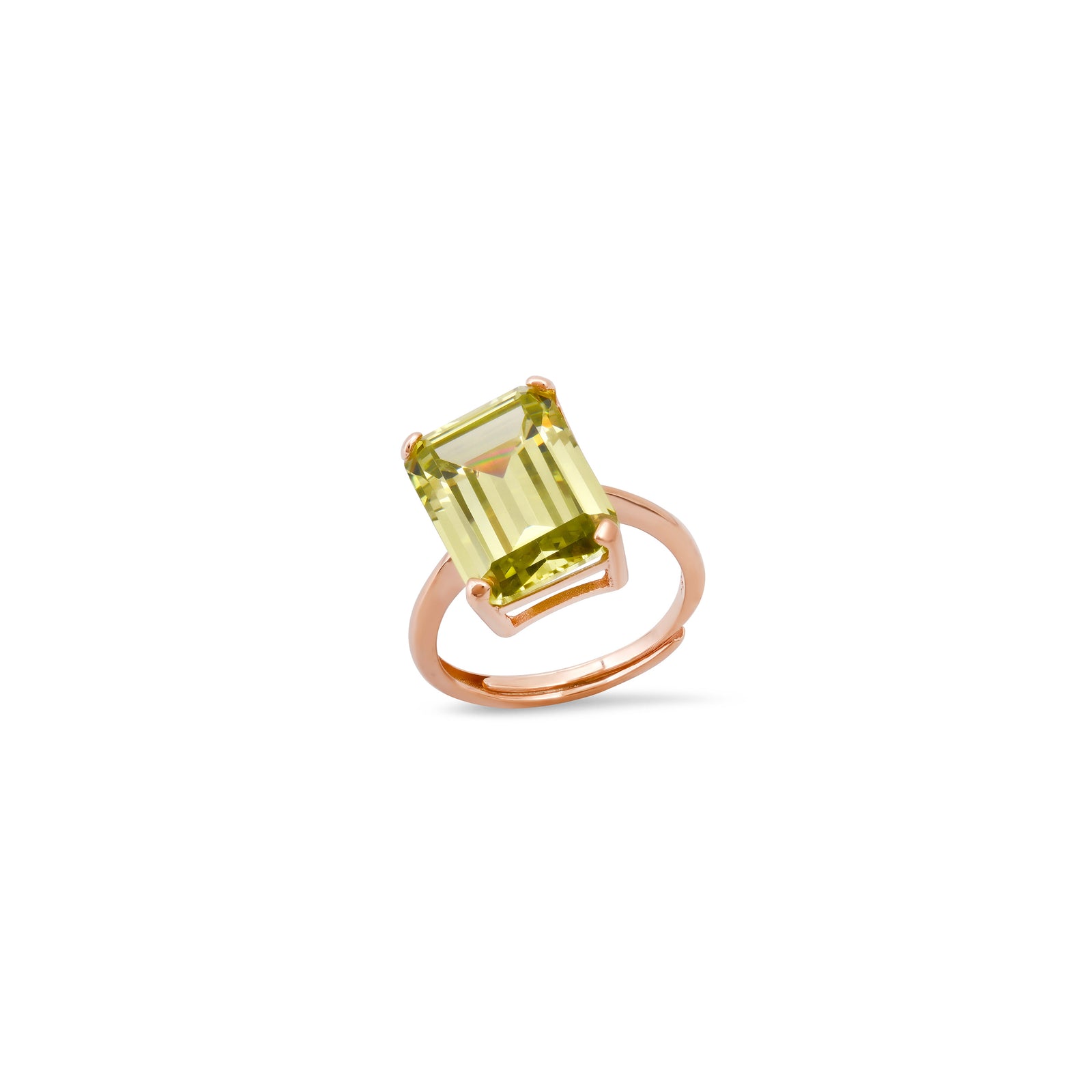Ring with a chartreuse gemstone and rose gold band on a white background