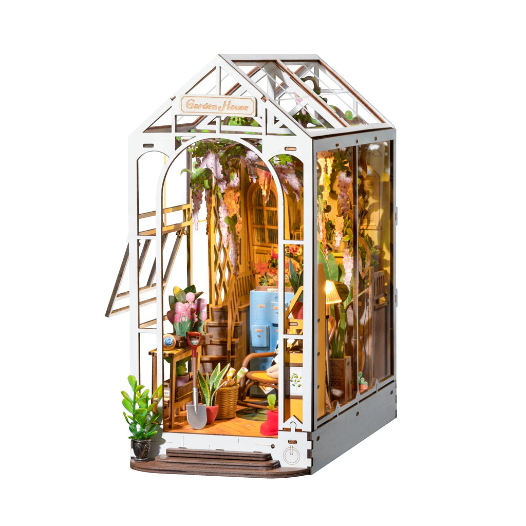 This charming miniature Garden House kit is so intricately and perfectly detailed, you will give it pride of place on your bookshelf. Its portrayal of a quiet and warm greenhouse full of vibrant colors is quite stunning. With detailed furniture and a delightful greenhouse. Finished model: 7.4" x 4.5" x 8.6" Age: 14+.