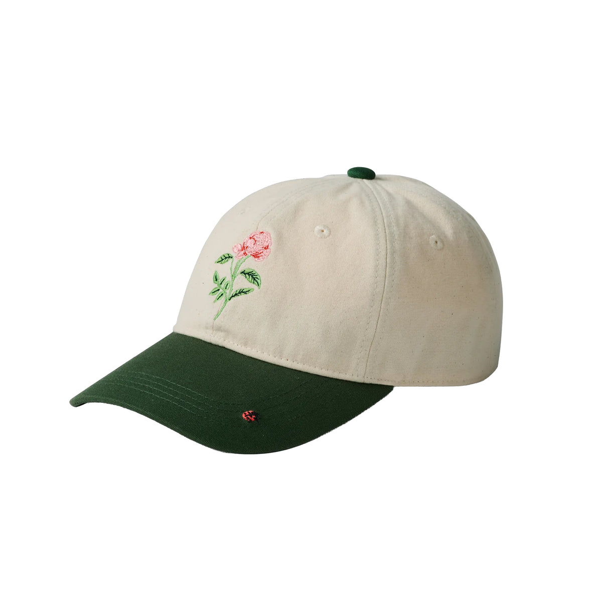 Beige cap with green bill and floral embroidery on a white background