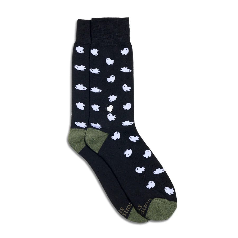 Black socks with white ghost patterns on a white background