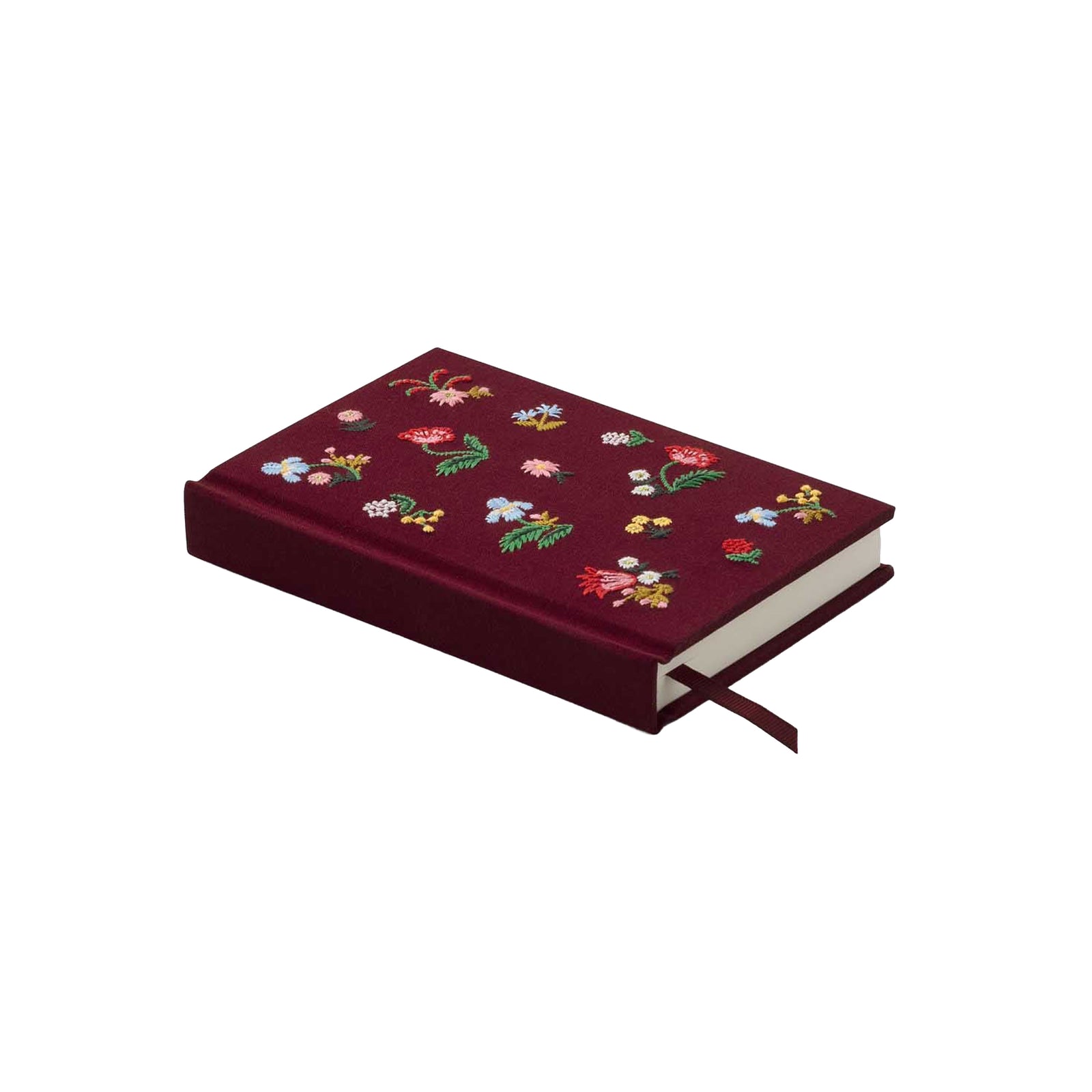 A hardcover notebook or journal in deep burgundy with colorful embroidered wildflowers across the front cover, shown on a plain white background.