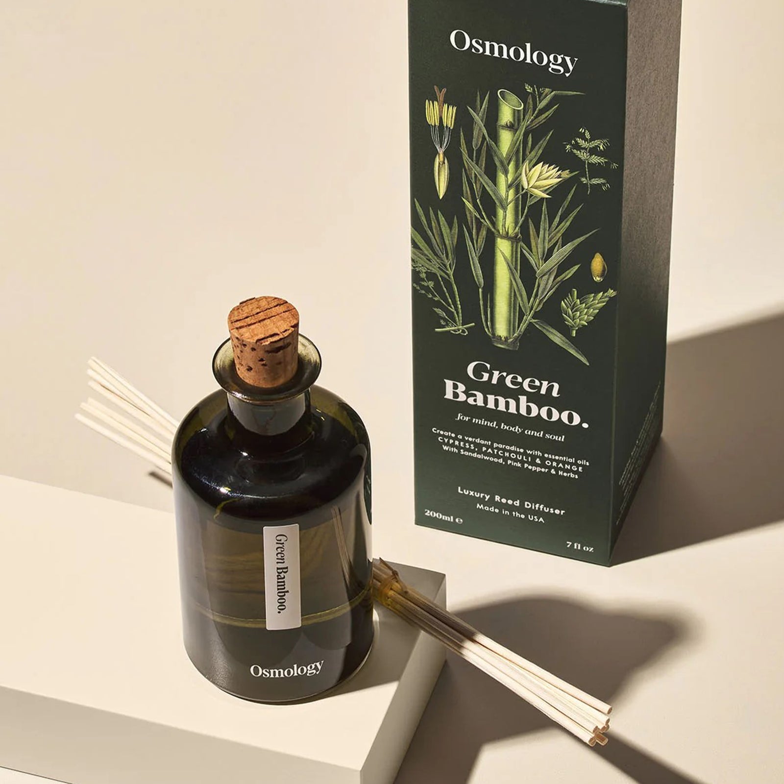 Osmology Green Bamboo diffuser with packaging on a white background