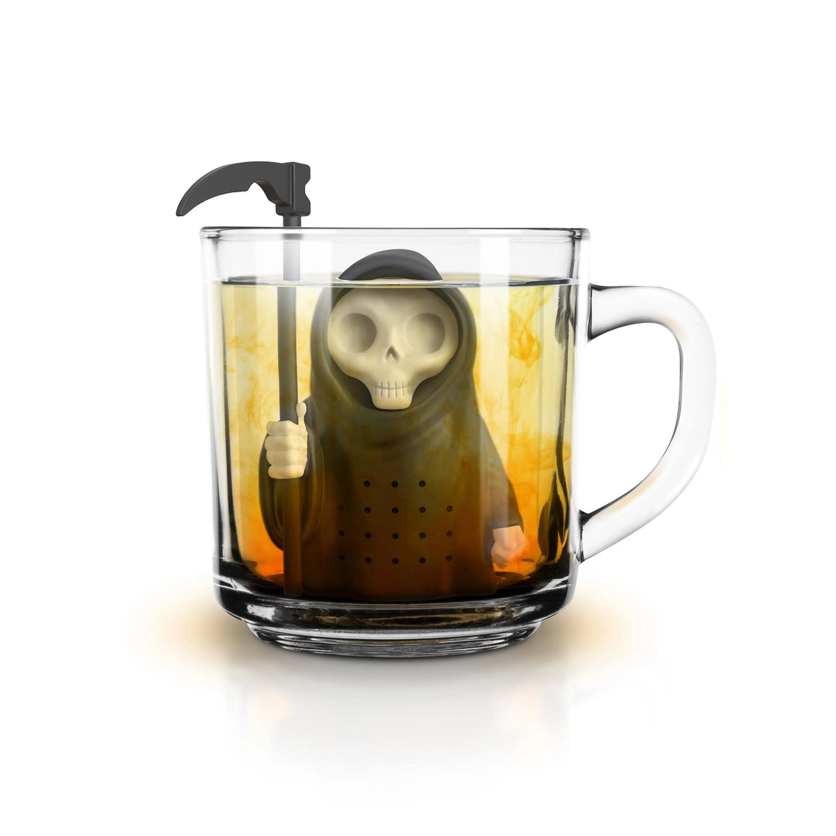 A clear glass mug filled with amber tea and topped with a black gothic-style lid, featuring a skull-faced tea infuser or decorative figure inside the mug on a white background.