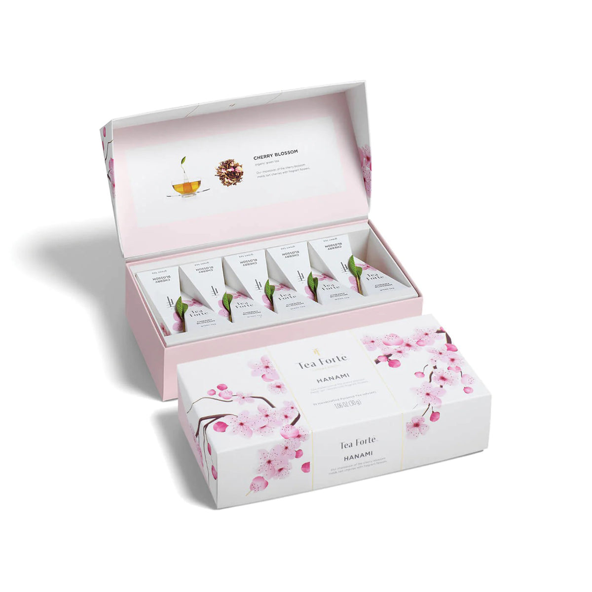 Tea set with cherry blossom design in a pink box on a white background
