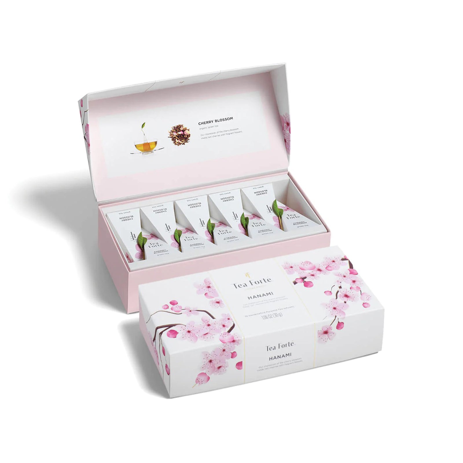 Tea set with cherry blossom design in a pink box on a white background