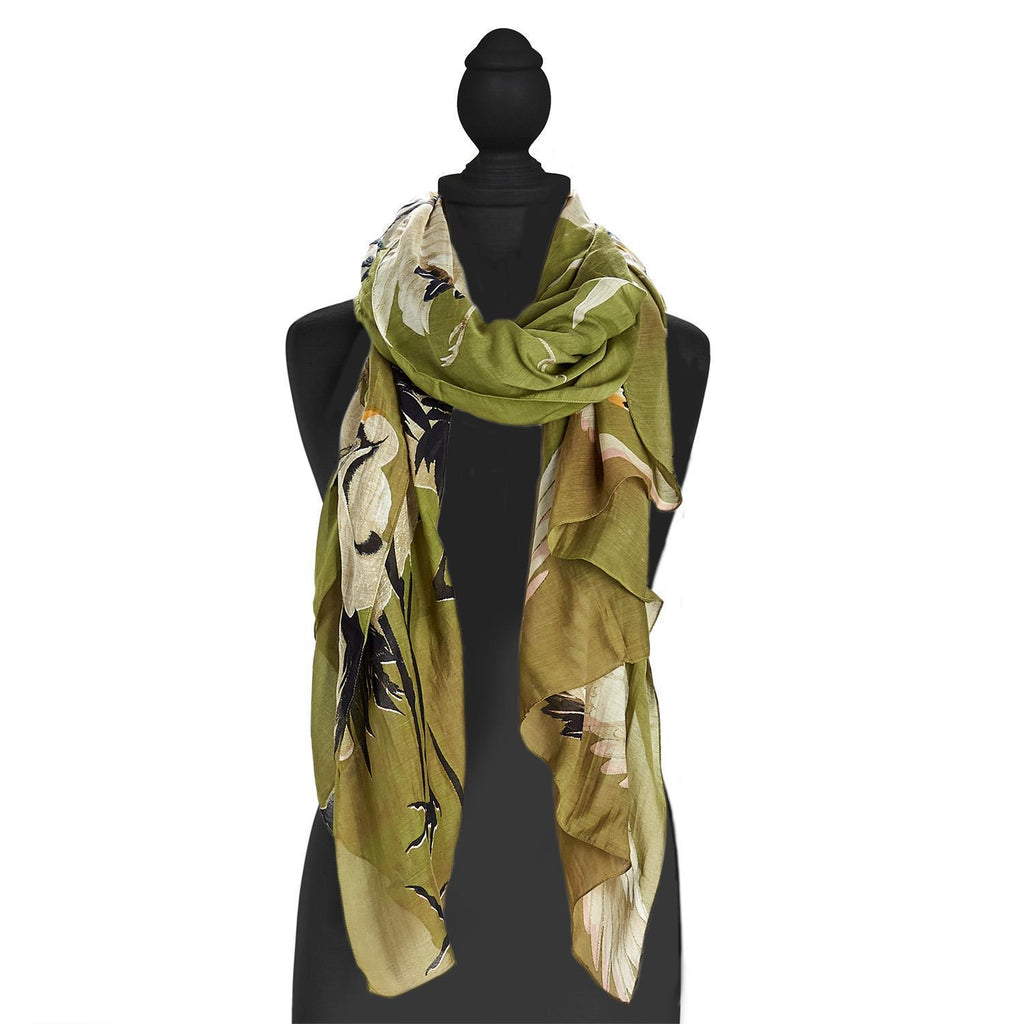 Olive green is the perfect neutral backdrop for a flock of beautiful herons. The long length of this scarf makes it super versatile - wear it as a scarf, sarong, a topper and more! Lightweight and super soft, it is made from an eco-friendly custom blend of 50% Modal & 50% Viscose. Scarf size: 40" W x 78 50%. Hand Wash.