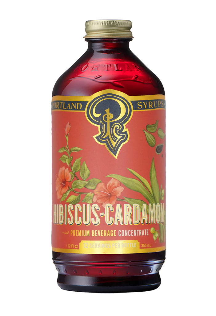 In this syrup, full, round berry flavors are developed from a careful blend of hibiscus flower and rose hip. Hand-ground whole toasted cardamom adds depth and subtle spicing. Ideal with clear liquors such and vodka and gin, or splash a half-teaspoon in a champagne cocktail, or mix with tequila.  12 fl oz bottle. 