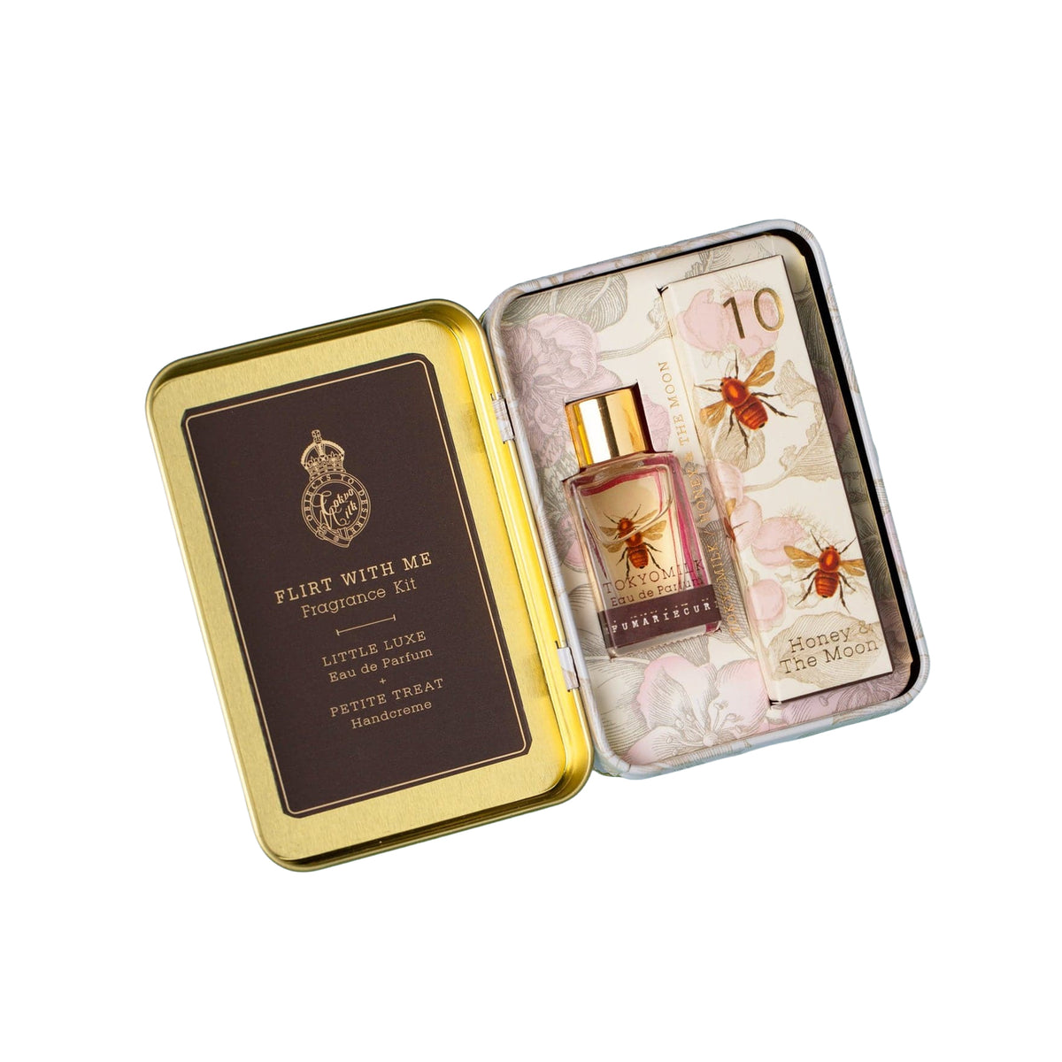 Perfume set with a gold tin featuring a bee design on a white background