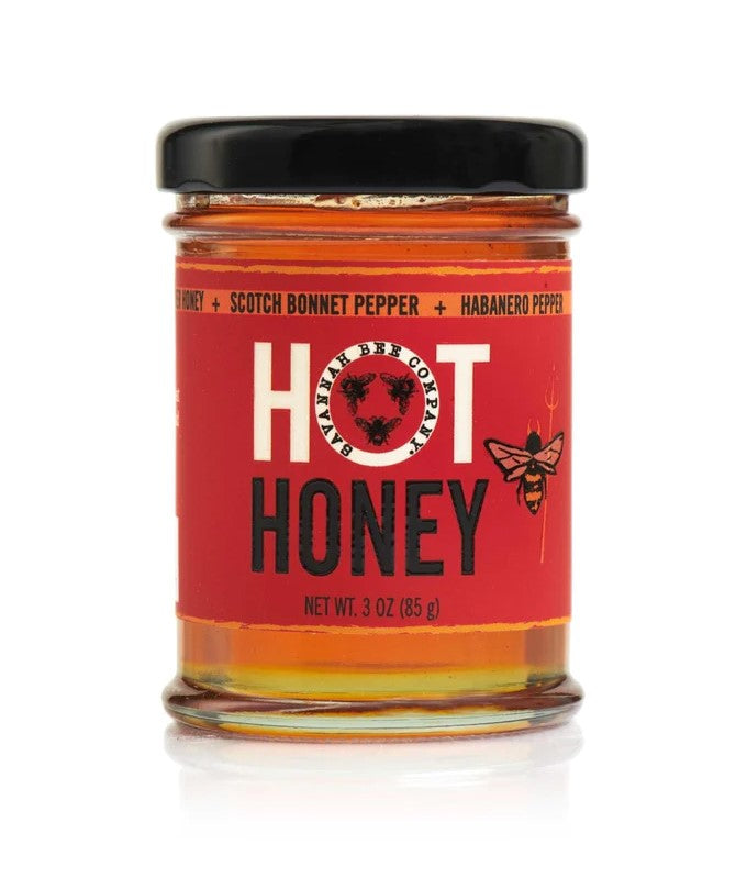 Life tastes sweeter with a little bit of sting! This sweet Wildflower Honey is infused with searing scotch bonnet and habanero peppers for a complex condiment that uplevels your favorite savory dishes, baked goods, and cocktails. TASTING NOTES: Sweet and spicy! Kosher. Gluten free. 3 oz glass jar.