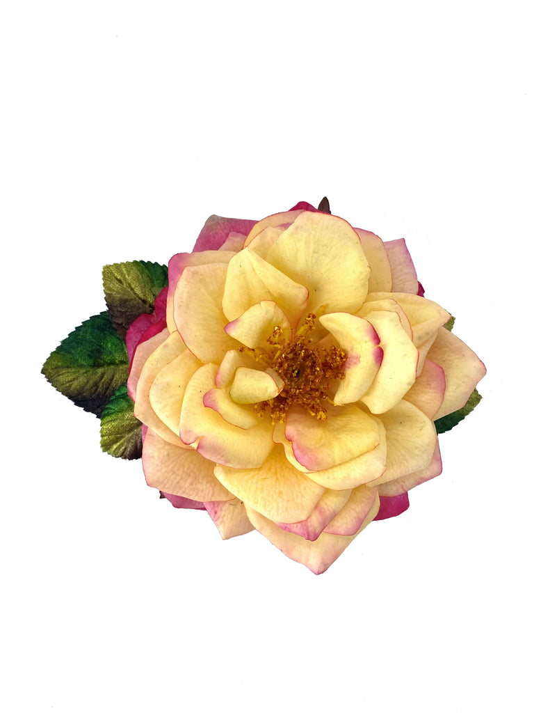 A beautiful pin featuring the 'Huntington's 100th' rose. The petals and leaves on this pretty rose have a velvety finish and are hand-tinted to give a realistic, natural effect.  Silk with velvet finish Has both a pin and a clip on the reverse Diameter: 5"