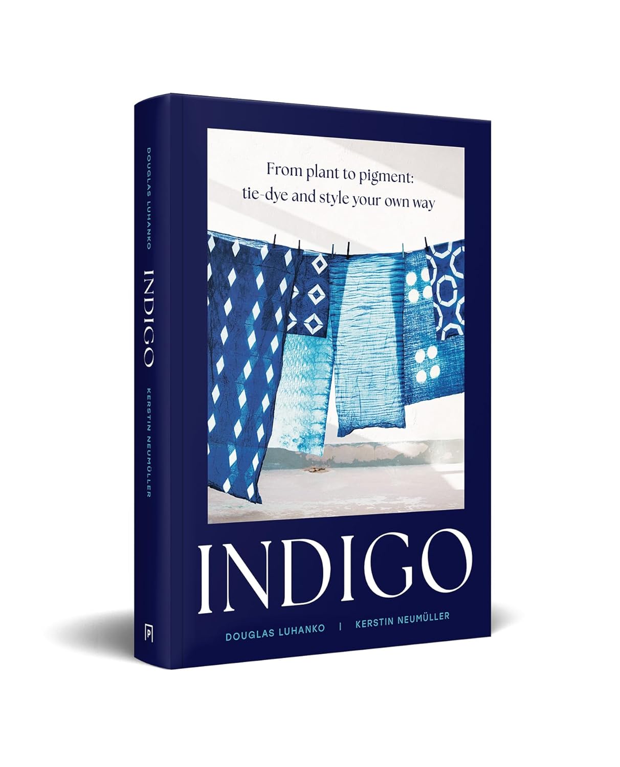 Book titled 'Indigo' with blue fabric on a white background