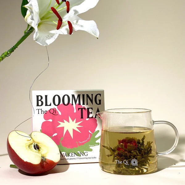 Box of Blooming Tea with floral design on a white background