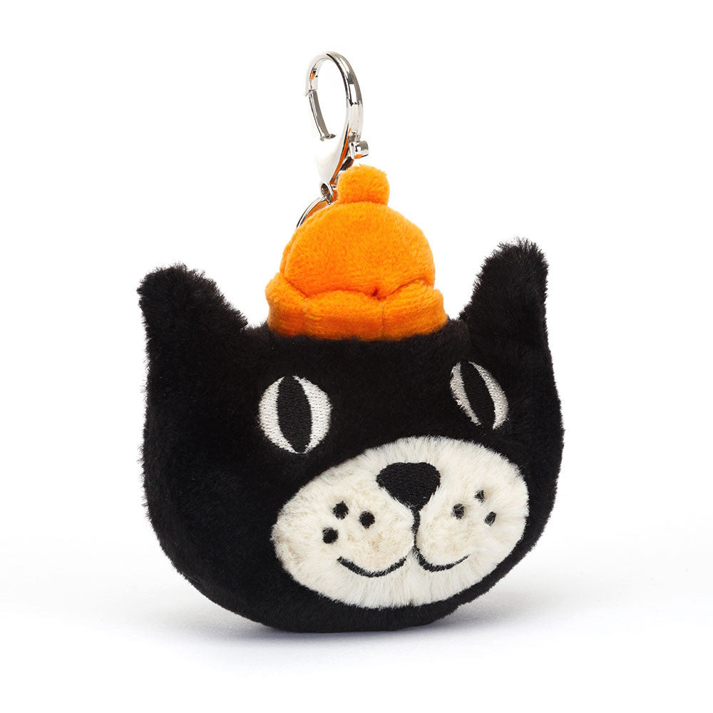 The Jellycat Bag Charm is a tiny piece of history – clip it onto your bag and celebrate with us! In black and cream soft textured fur with an orange jelly crown, Jellycat name disc and silver claw clip, this mini kitten is a freckled icon. Dimensions: 4" x 3.5" x 1.5" Not suitable for children under 12 months.