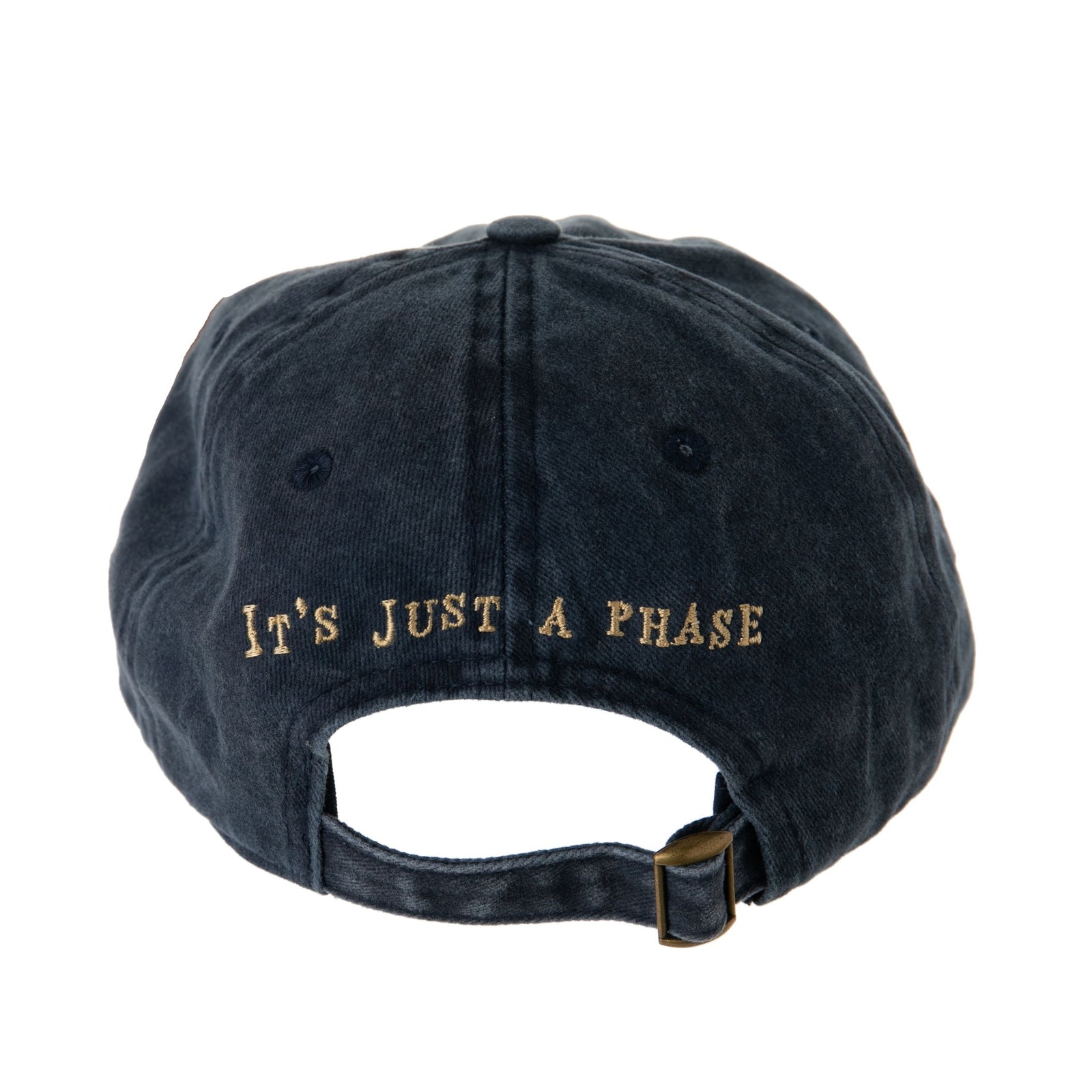 This comfortable cotton baseball cap features an embroidered "It's Just A Phase" sentiment with stitched moon phase design. Navy cotton base with adjustable brass closure on the back. Cotton baseball cap Metal buckle at the back for adjustment One size fits most. Hand-wash only.