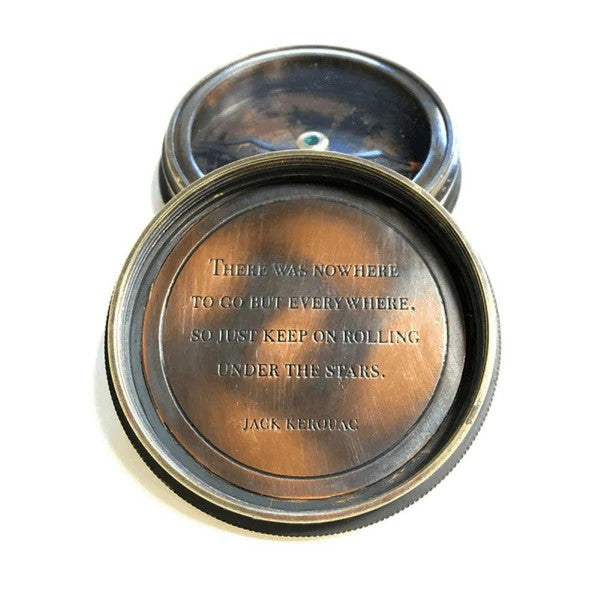 This vintage style compass features a twist-off lid which is inscribed inside with a quote from Kerouac's most famous work, On the Road. The quote reads; "There was nowhere to go but everywhere, so just keep on rolling, under the stars". Metal compass with leather carrying pouch Compass diameter: 2.25".