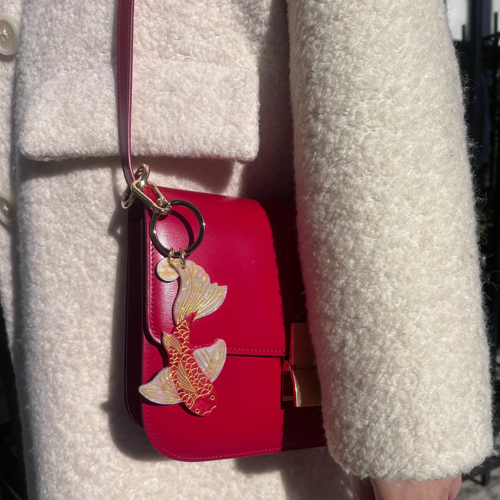 This vibrantly colored Koi fish key chain / bag charm has a hand-painted finish and is crafted in small batches. It's designed to upgrade your favorite bag or set of keys. Designed in New York City, the double-sided charm is hand-painted on both sides, for an iconic look from all angles. Made from super-strong, eco-friendly biodegradable acetate. 