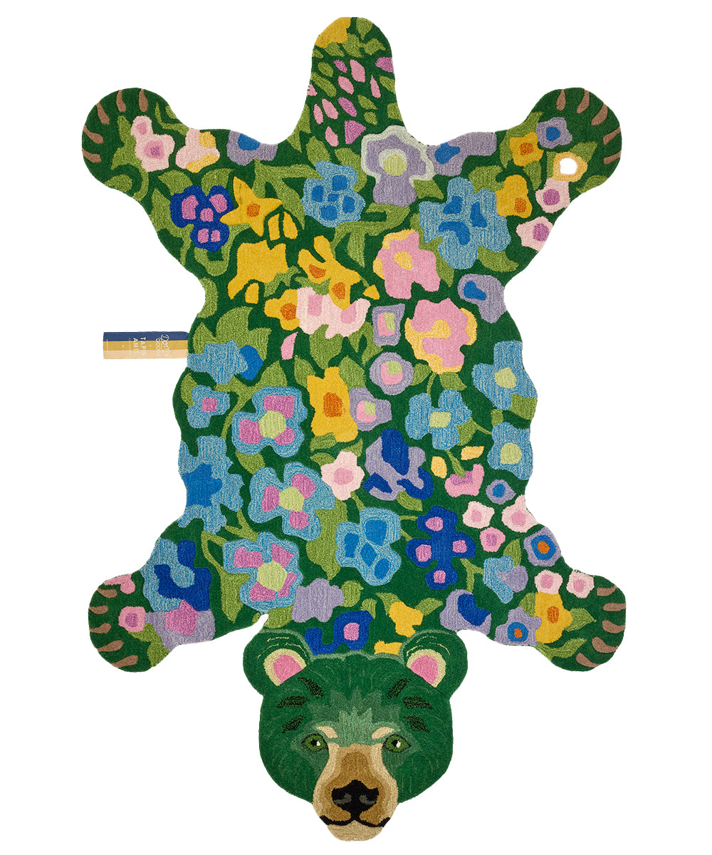 Add a whimsical touch to your space with this delightful bear-shaped rug. This high-quality, 100% tufted wool rug is made with premium craftsmanship to ensure both style and comfort. It features a vibrant floral design, making it a gorgeously fun and colorful accent for any room. Perfect for kids' rooms, nurseries, or as a playful addition to your living room, it is the perfect blend of fun and elegance. Available in two sizes. Dimensions: Small: 36" x 24" x 1" Large: 94" x 64" x 1"