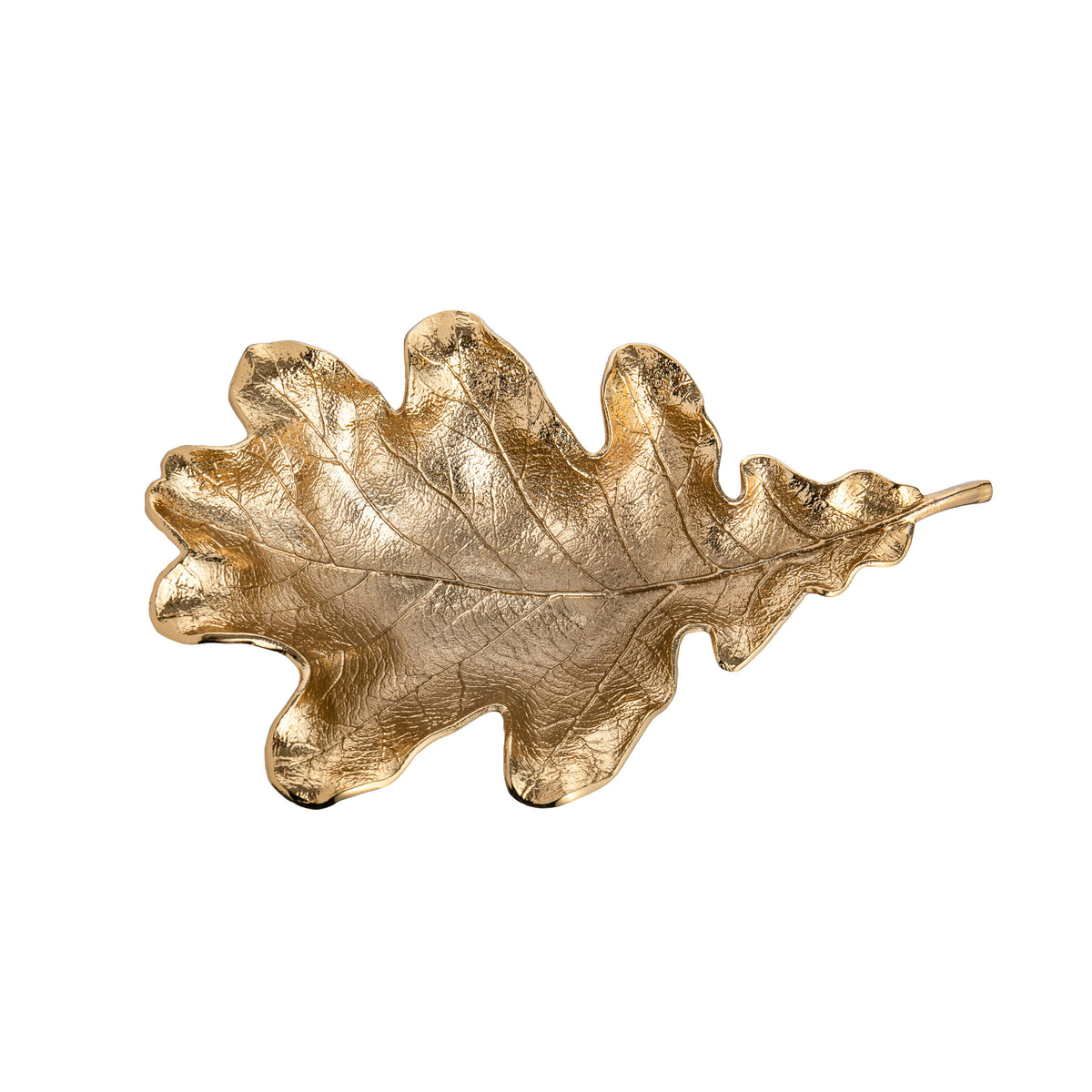 Gold oak leaf-shaped dish on a white background