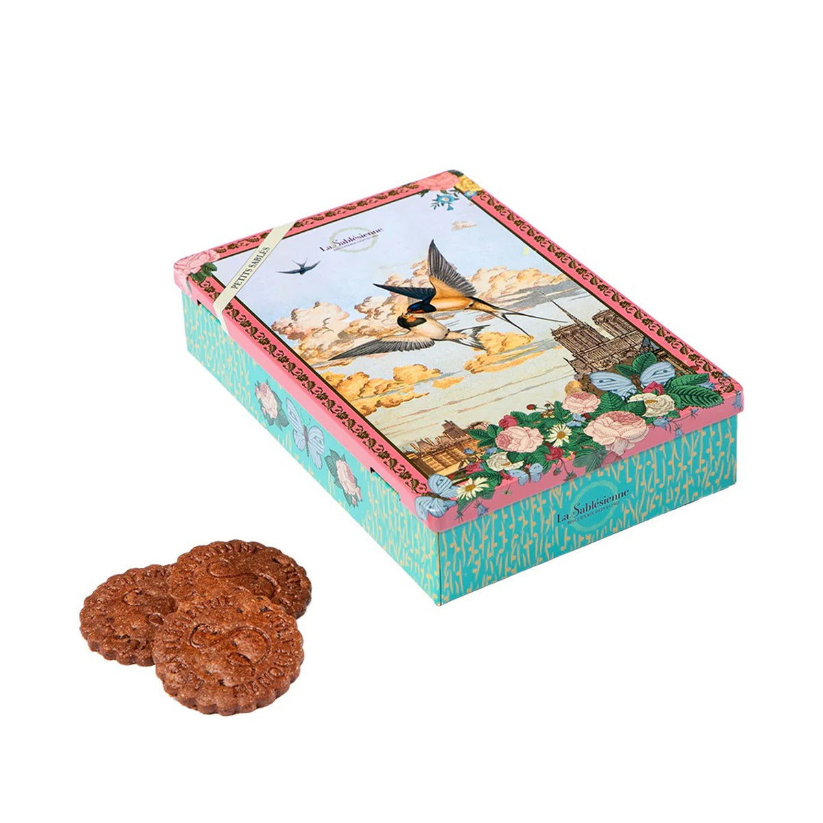 Decorative cookie box with a scenic design and cookies in front