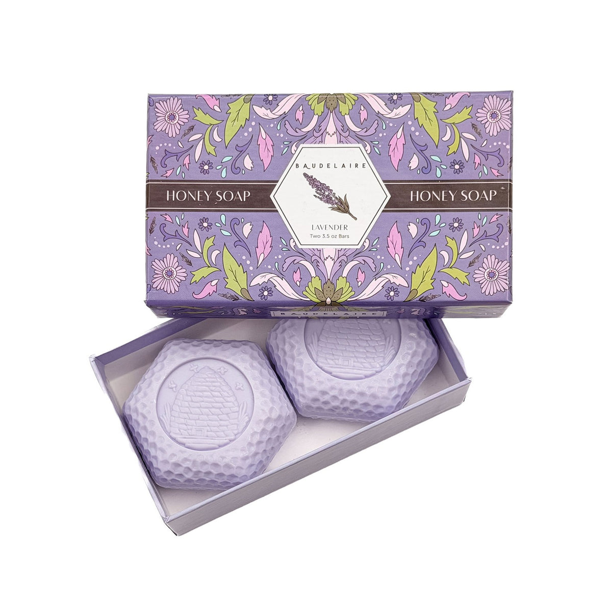 Two lavender honey soaps in a decorative box with floral design.