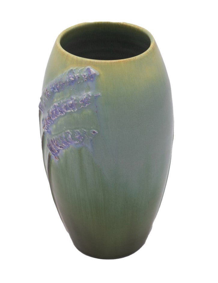 A ceramic vase with a green base color, featuring painted lavender sprigs in a watercolor style.