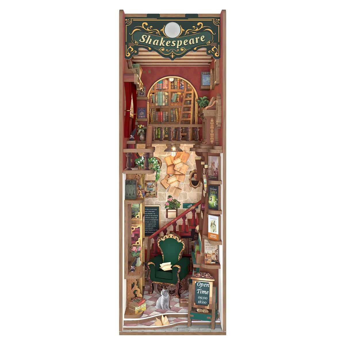 A vertical rectangular book end featuring a detailed miniature library interior with bookshelves, a staircase, a green armchair, a cat, and a Shakespeare-themed sign at the top, shown on a plain white background.