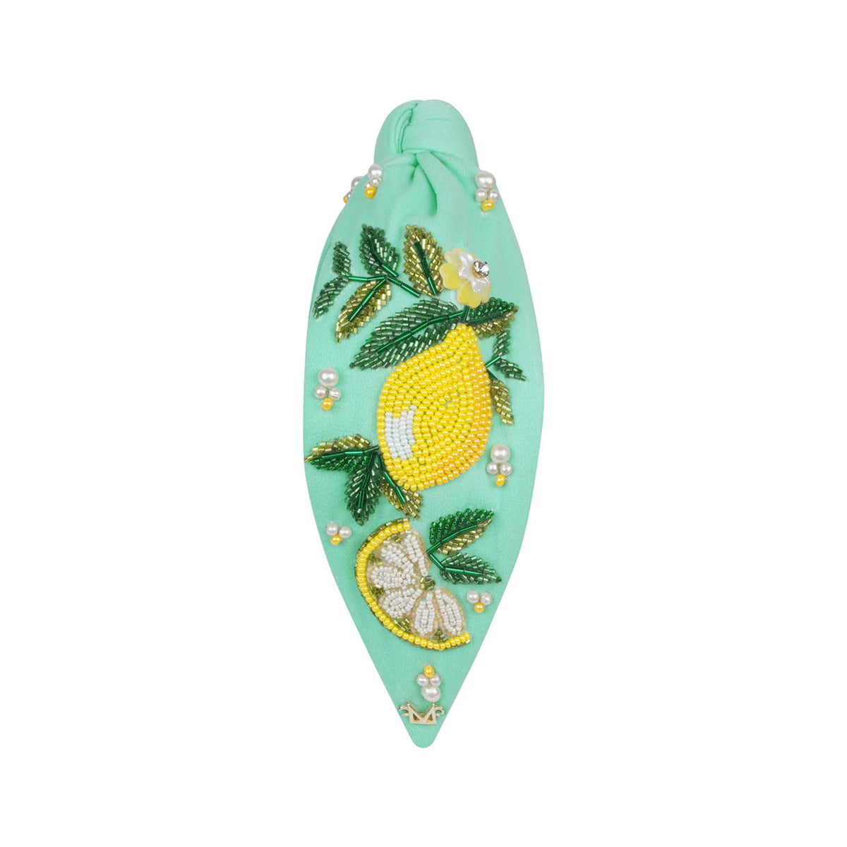 Decorative hairband with lemon design on a white background