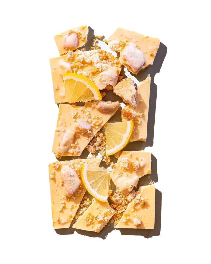 This lemon shortbread white chocolate bar is a feast for the senses, gorgeous packaging with an even more delicious chocolate bar inside. Homemade lemon preserves and shortbread cookies collide in a lemon infused chocolate that is tangy, sweet and lip puckeringly delicious. Net wt: 3oz.