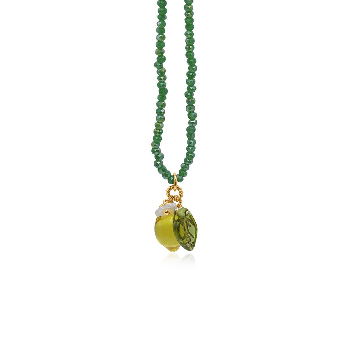 A green beaded necklace featuring a pendant with a gold-tone ring, a small white stone, and two leaf-shaped green beads, shown against a plain white background.