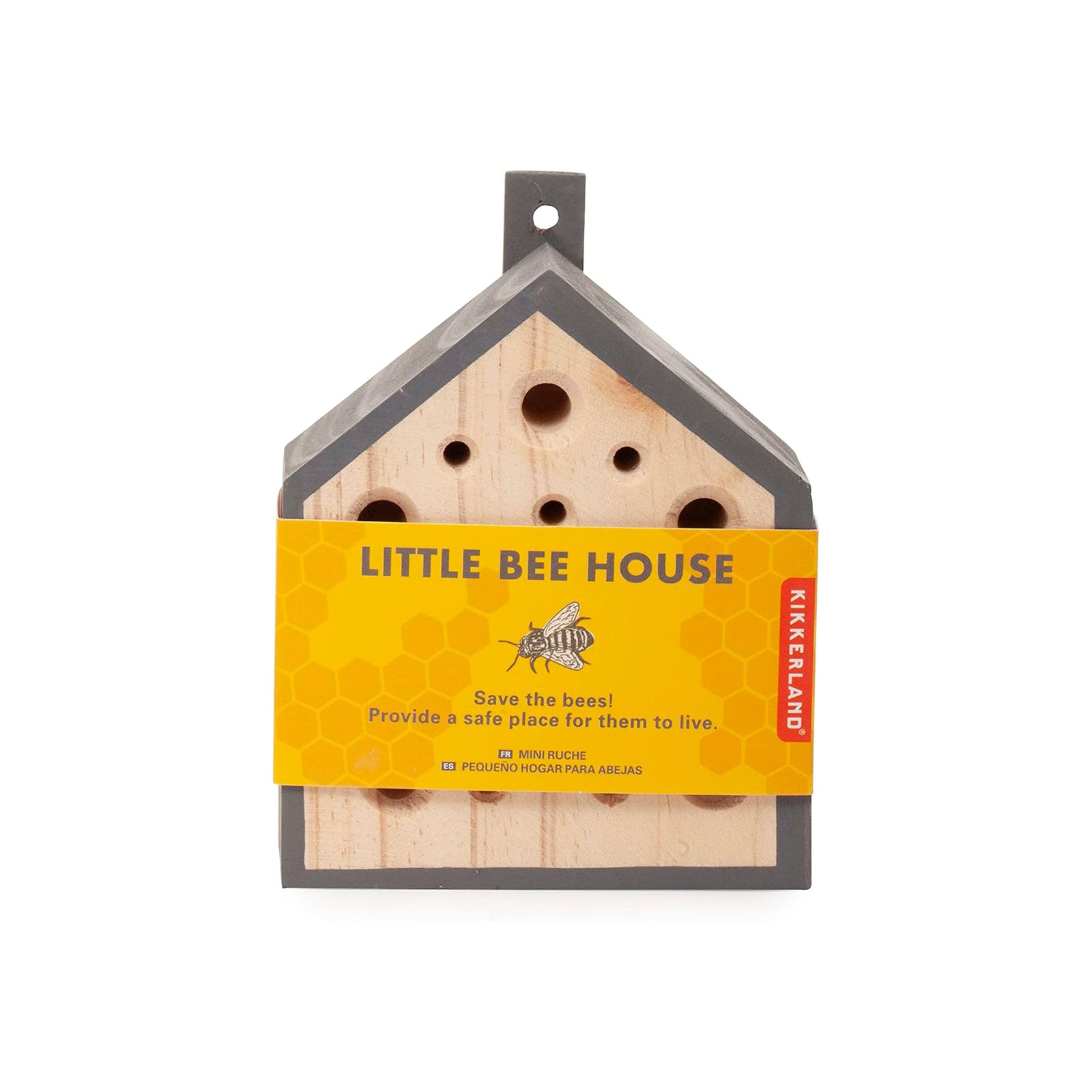 Wooden bee house with a yellow label on a white background