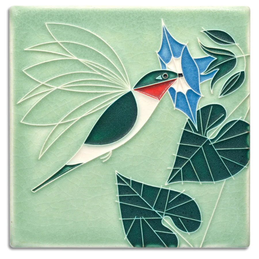 "The hovering ruby-throated hummingbird nips nectar from a morning glory, enjoying a motionless in-flight meal. Mid-century modern meets Motawi mastery in these tiles based on the work of wildlife artist Charley Harper (1922-2007). Each tile is crafted by hand. 5/8" thick with a notch at the back for hanging.