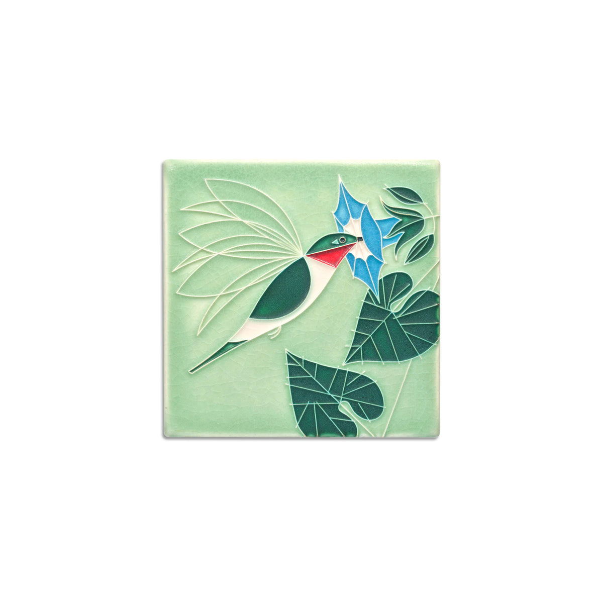 Decorative tile with a bird and floral design on a light green background