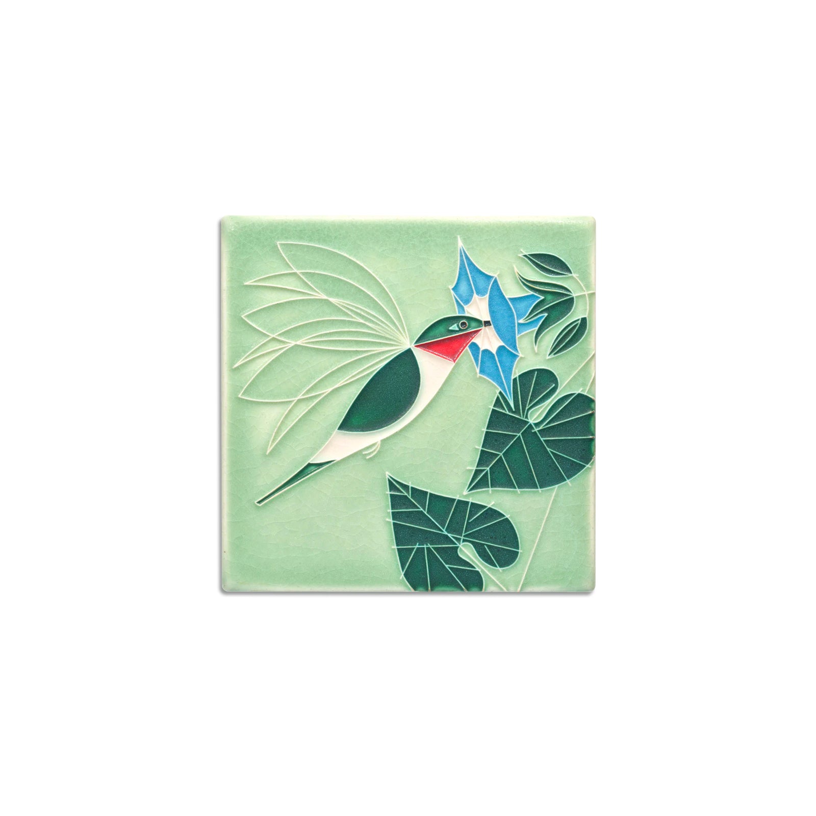 Decorative tile with a bird and floral design on a light green background