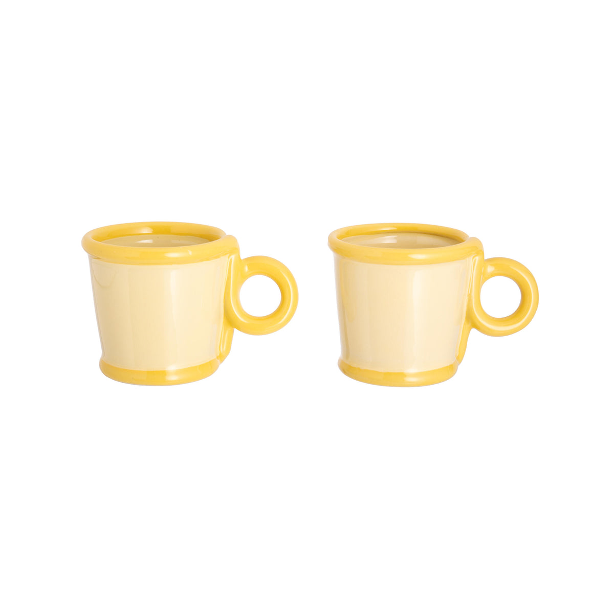 Two yellow ceramic espresso mugs on a white background