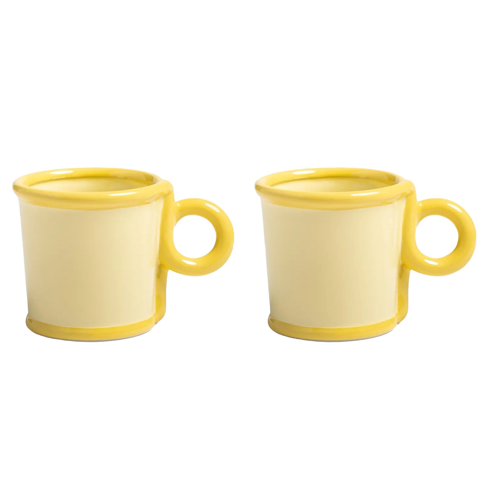 Two yellow ceramic espresso mugs on a white background