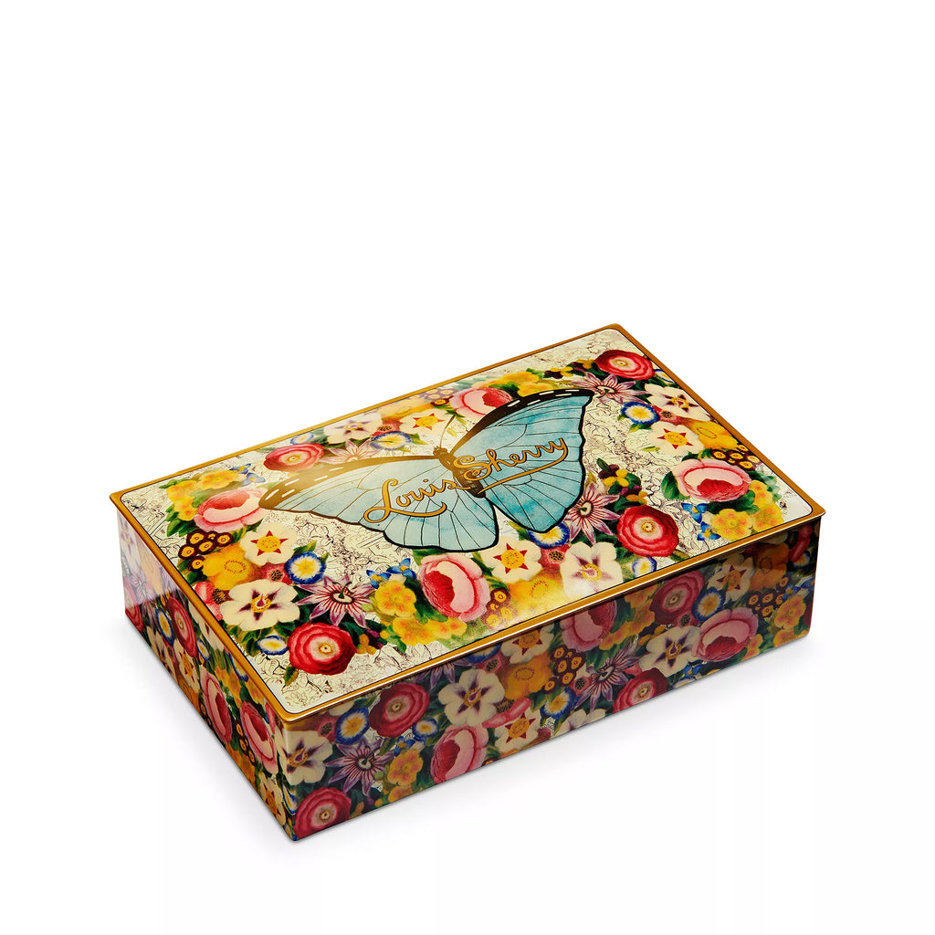 Indulge your senses in this decadent selection of Louis Sherry chocolates, all packaged in a gorgeously decorated tin. The tin features a design by artist John Derian, an American decoupage artist living in New York. Includes: 12 pieces of exquisite house-selected Louis Sherry truffles, known for their creamy texture. 6 oz. 
