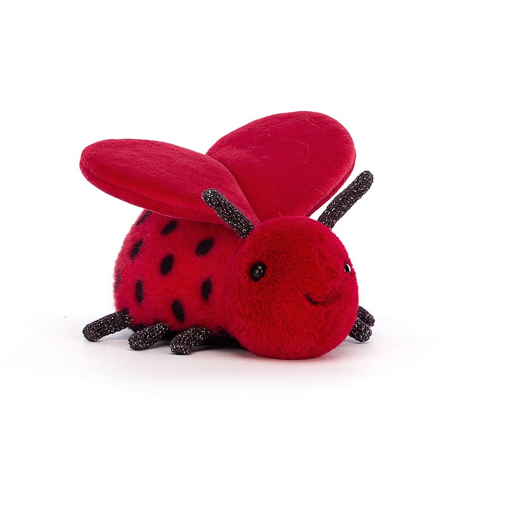 Loulou Love Bug is buzzing with romance, working those heart-shaped wings! Smiley-faced Loulou has rich scarlet fur with polka-dots, a cute squidge of a tum, and sparkly legs and feelers. The perfect gift for your funny Valentine – who doesn't want to cuddle a bug? Dimensions: 2" x 5". Suitable from birth.