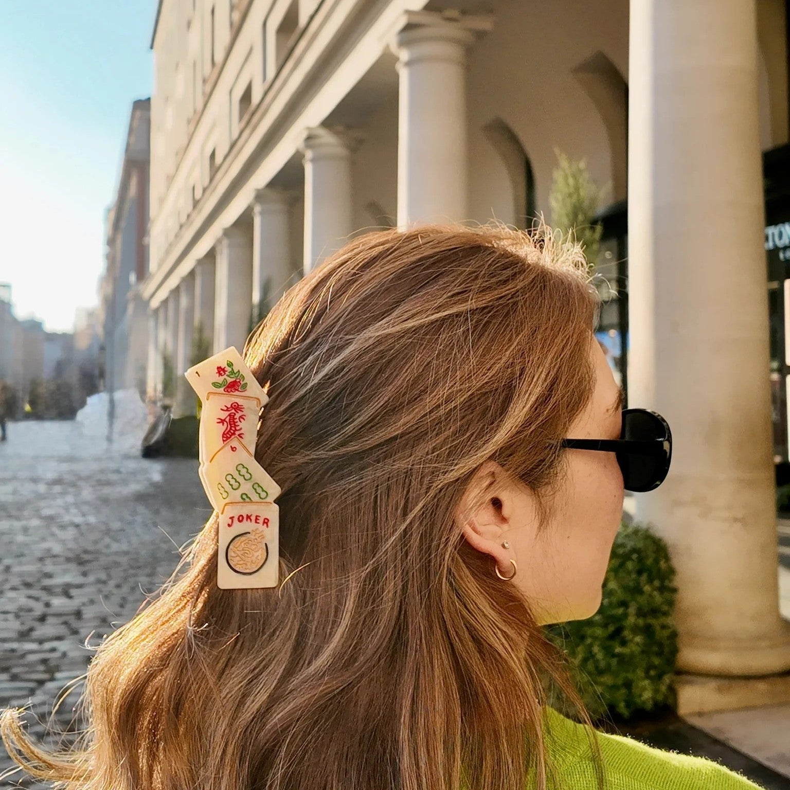 Hair clip in the shape of Mahjong tiles on a white background