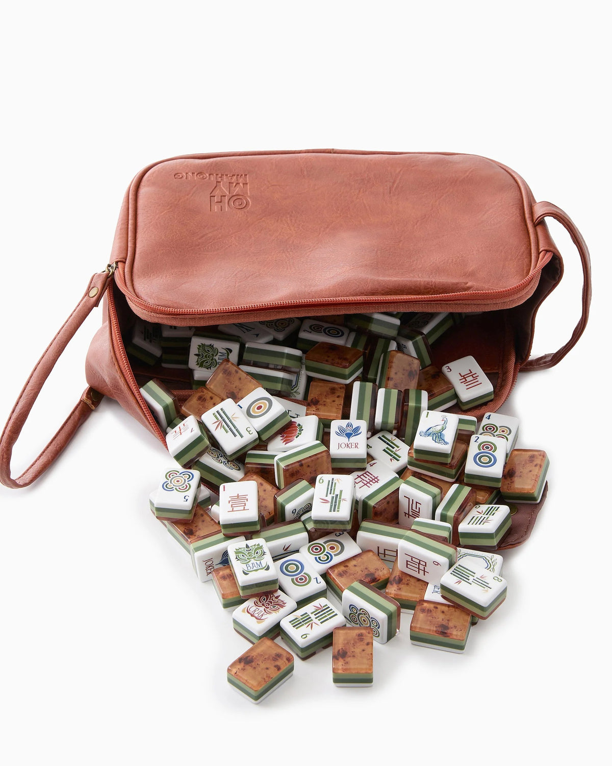 Brown leather bag with a spilling out of wooden mahjong tiles on a white background