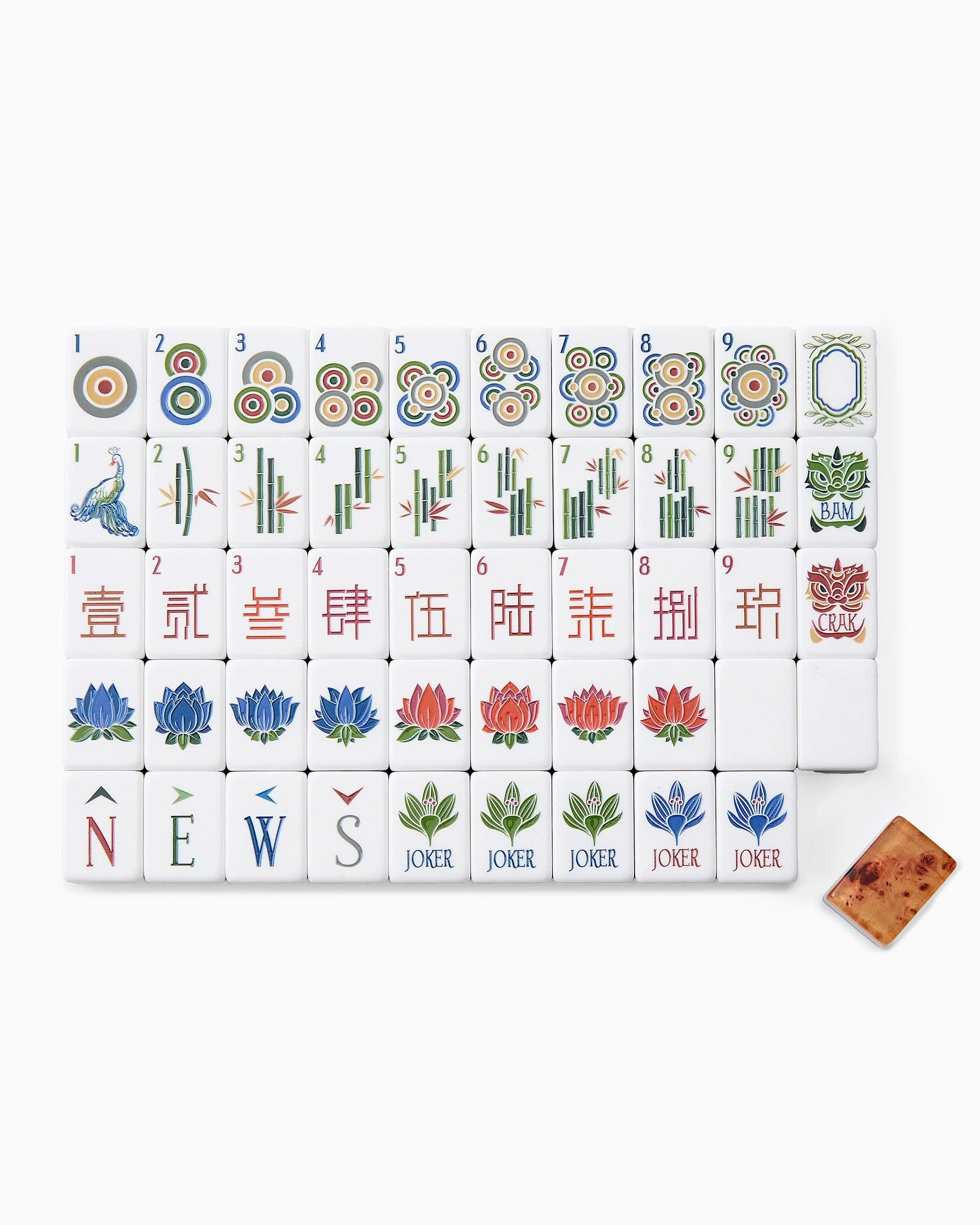 Brown leather bag with a spilling out of wooden mahjong tiles on a white background