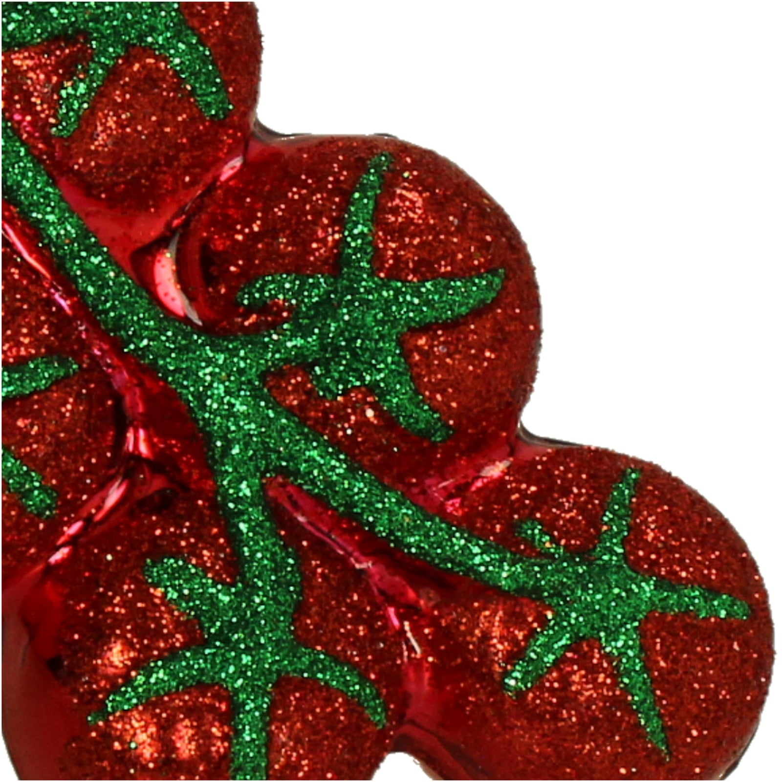 Red glass tomato Christmas ornament with green vine on a white background