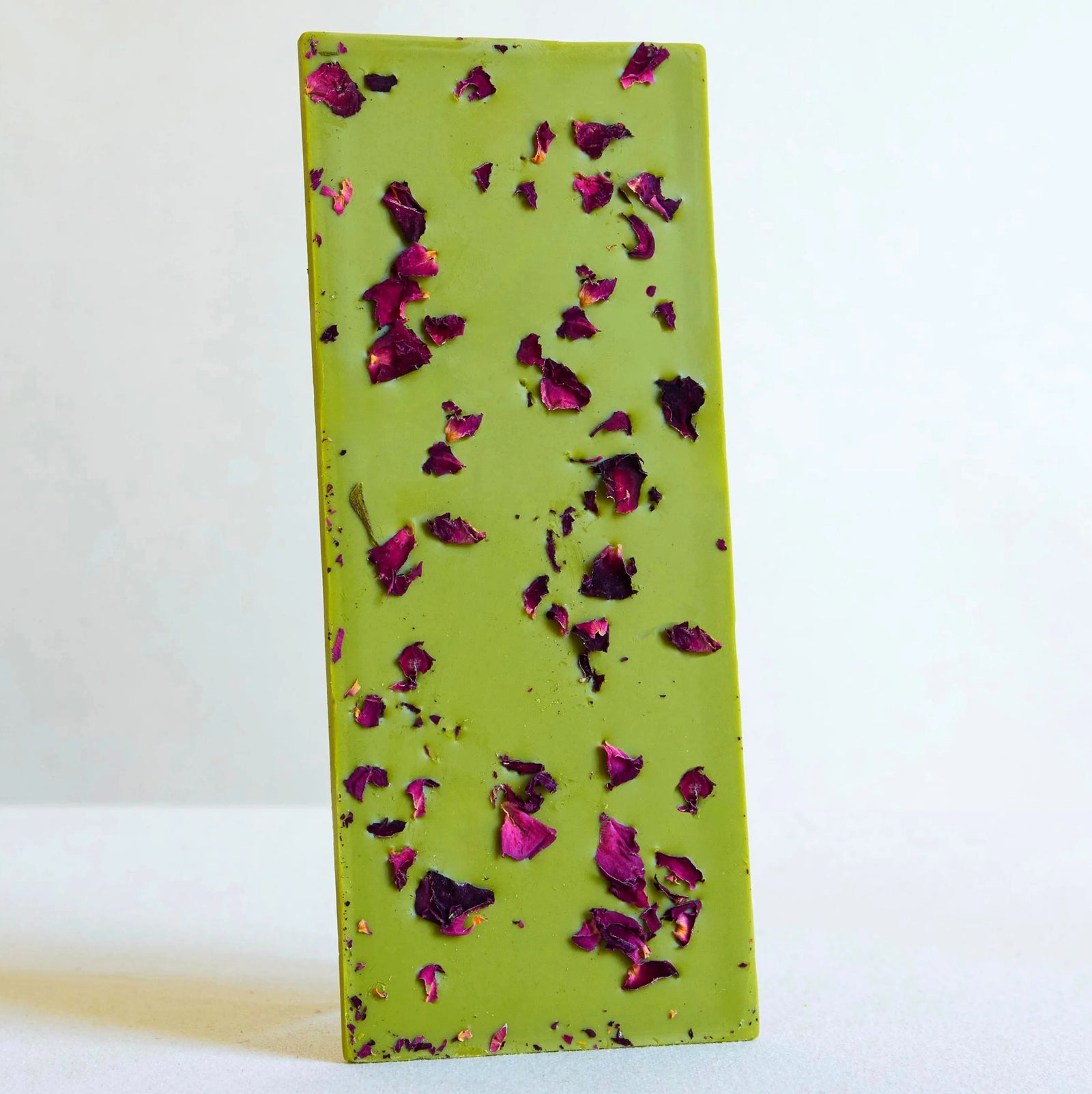 Matcha rose flavor chocolate in rose print packaging with floral design and text on a white background