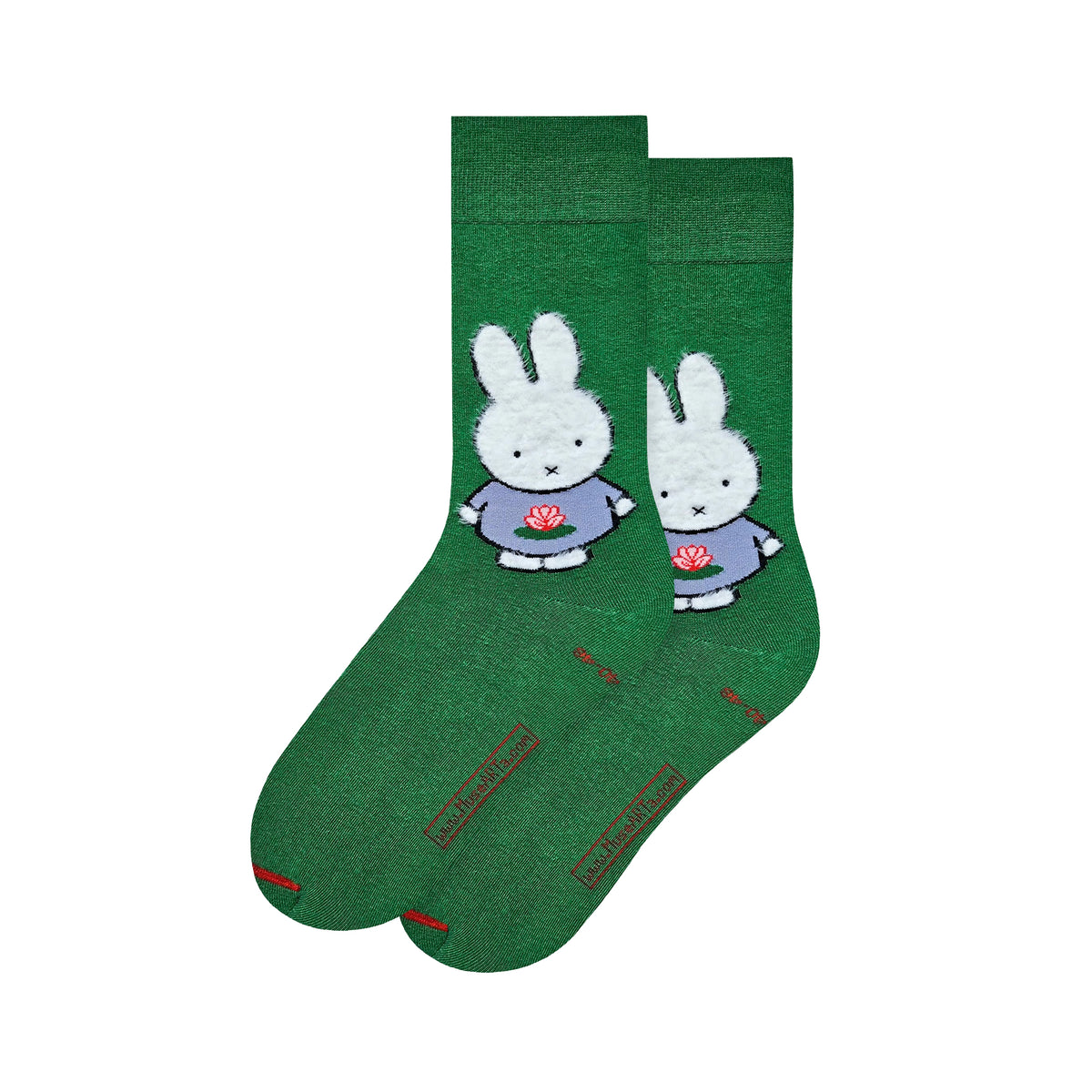 A pair of dark green crew socks featuring cartoon rabbit Miffy by Dick Bruna characters wearing lavender shirts and holding red flowers, displayed against a solid white background.