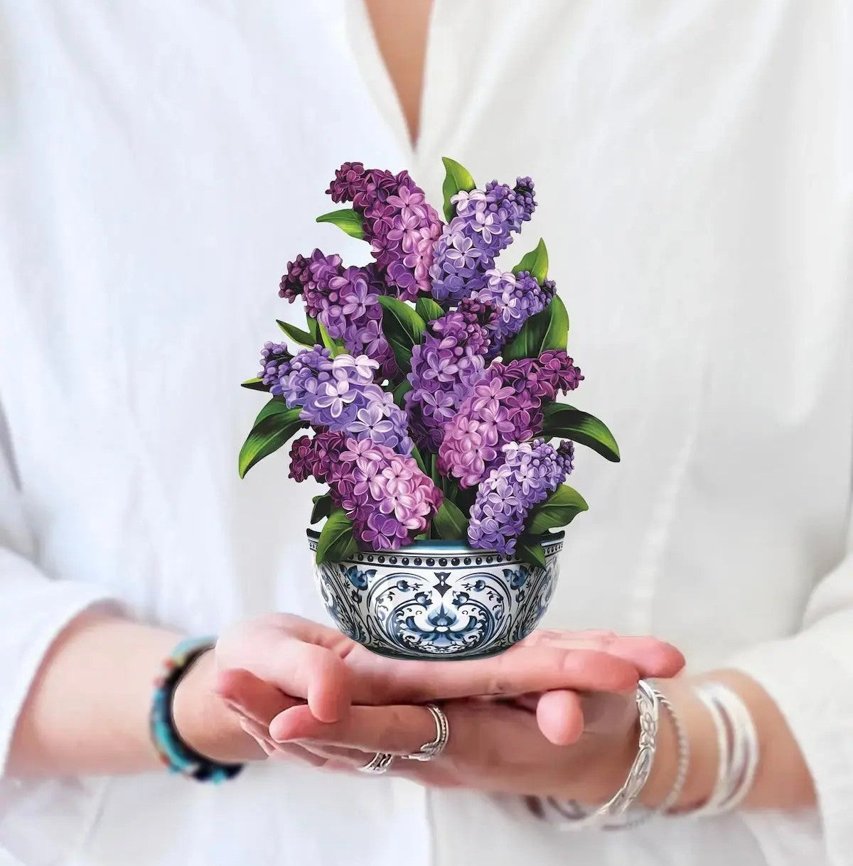 Bouquet paper pop-up lilac flowers in a decorative vase with matching card on a white background