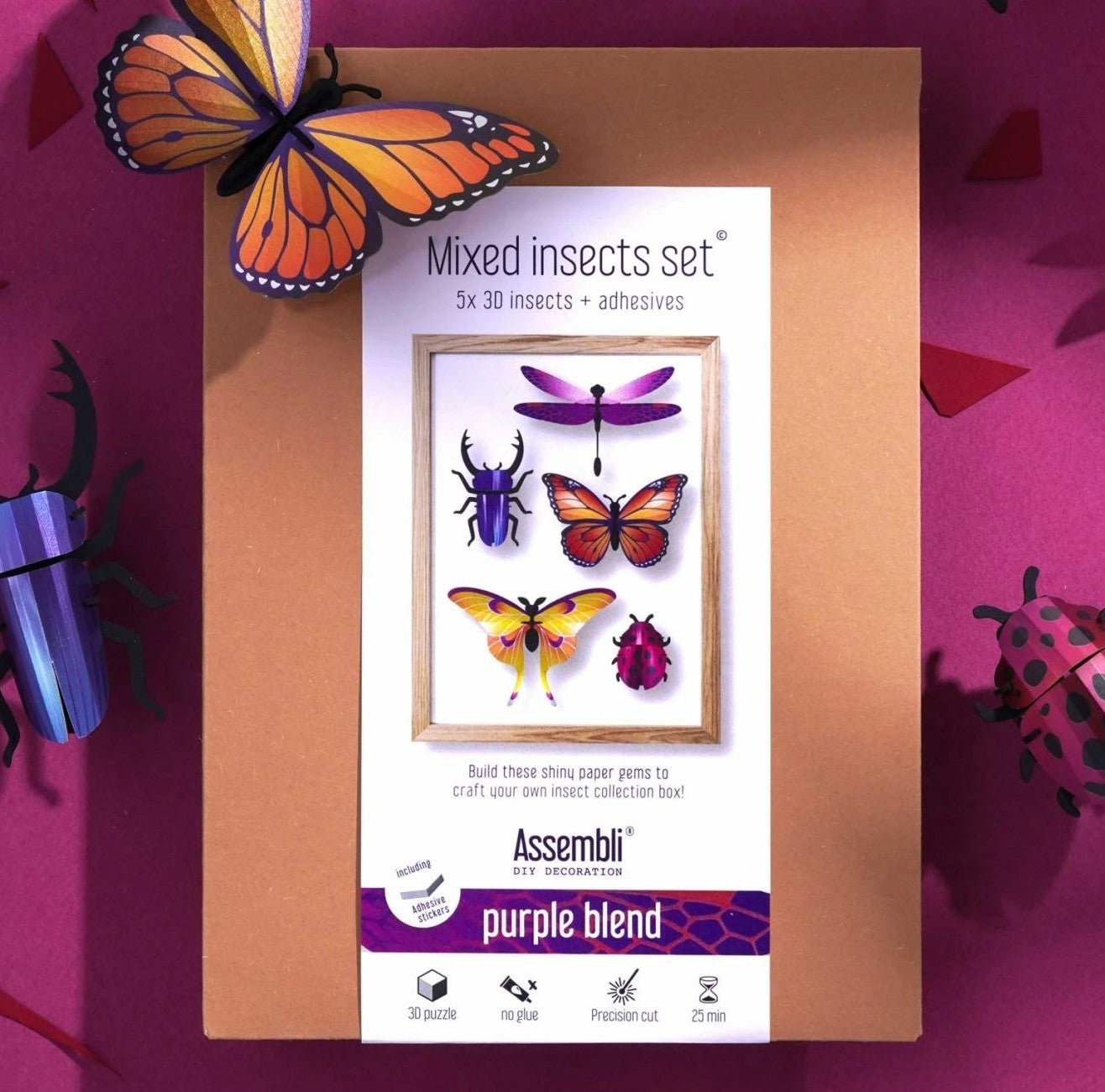 Colorful insect-shaped wall art on a white background