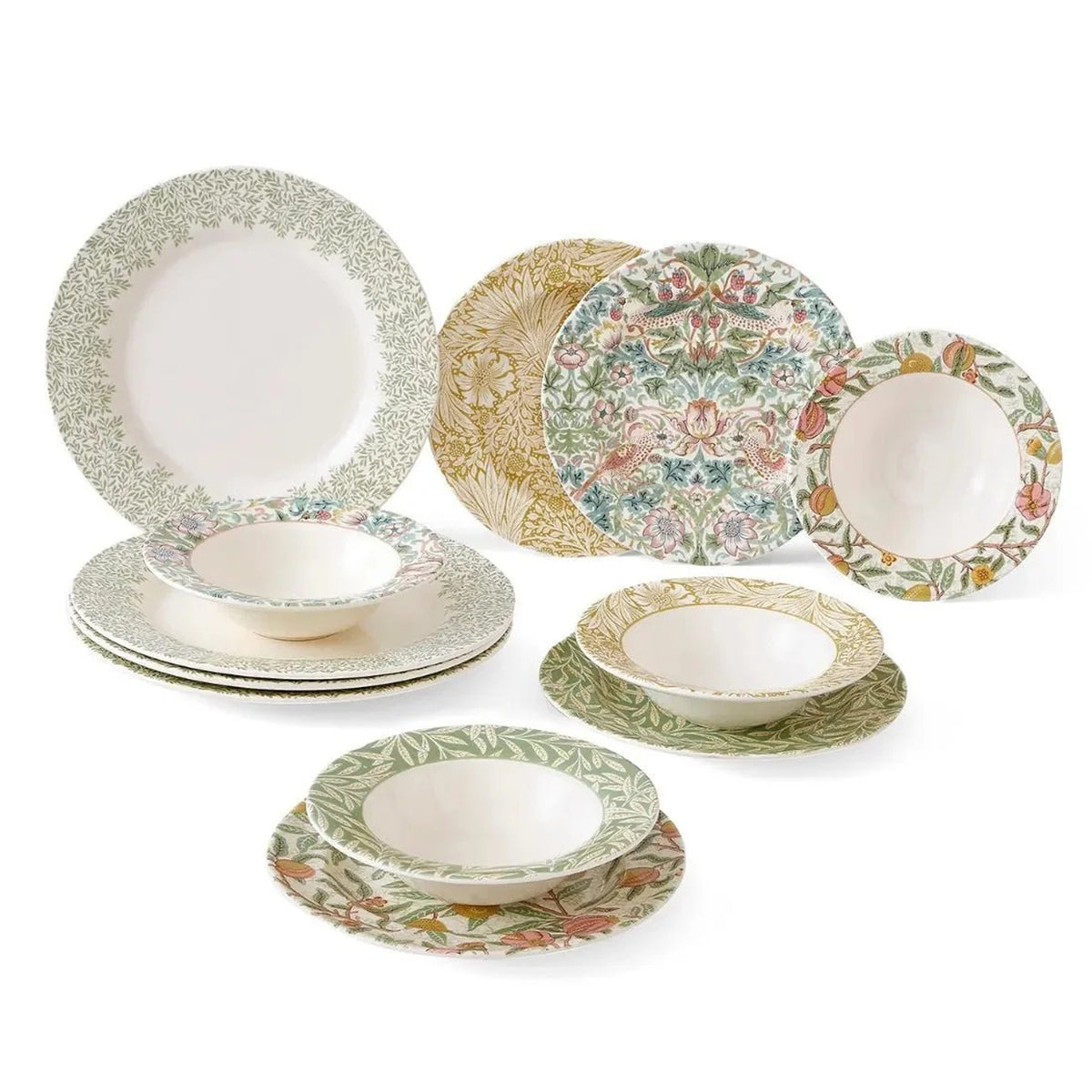 Set of decorative dinnerware with floral, William Morris patterns on a white background