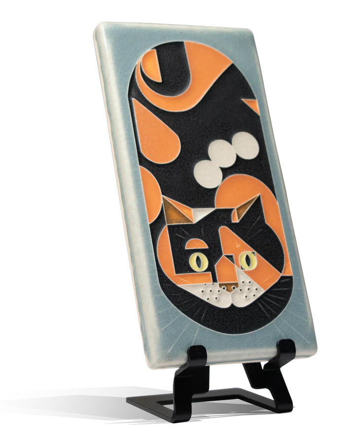 This friendly 4x8 feline is based on Charley Harper’s stylized midcentury design. Motawi tiles are striking art pieces and installation accents. Each tile is made by hand and with heart in Ann Arbor, Michigan. Tiles are 5/8" thick and have a notch at the back for hanging. Tile easel sold separately.