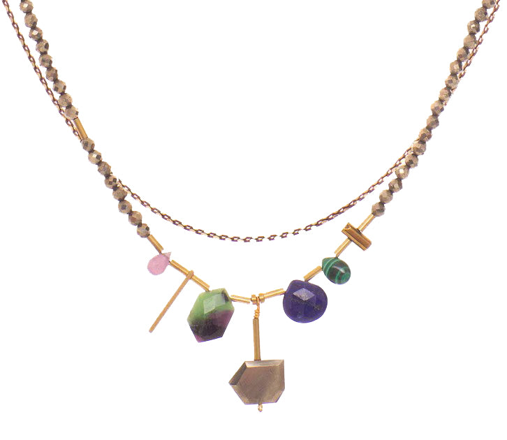 This beautiful, layered necklace features an eye-catching strand of faceted gemstones, spaced throughout with recycled brass tubes to create the perfect balance between modern and timeless. Materials: Recycled, vintage brass. Gems including Lapis, Malachite, Ruby Zoisite, Ruby & Pyrite Length: 17" with 3" extender.
