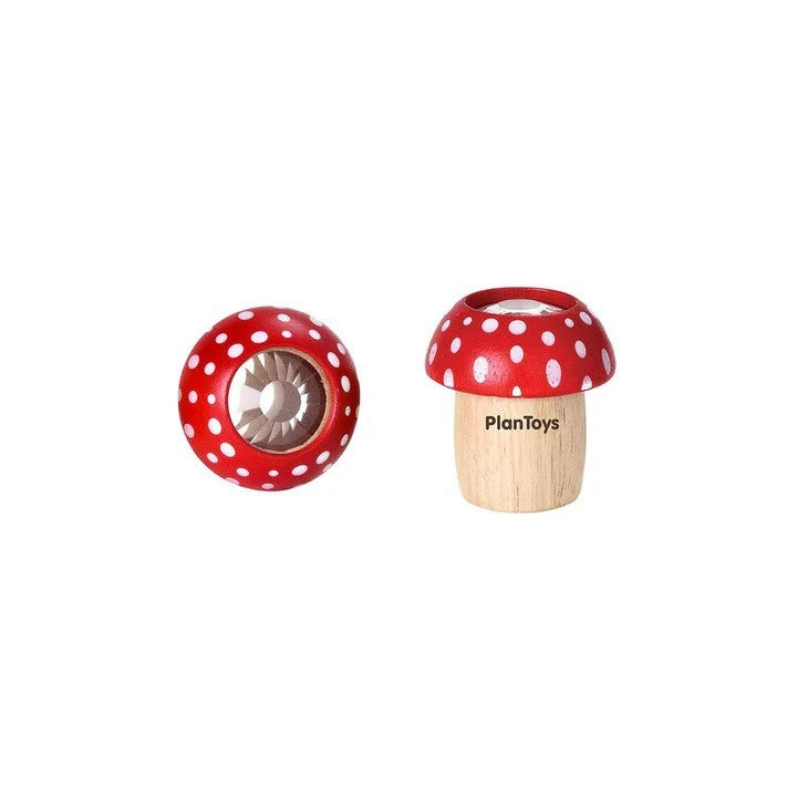 Wooden toy mushroom  kaleidoscope with red polka dot cap on a white background, branded 'PlanToys'.
